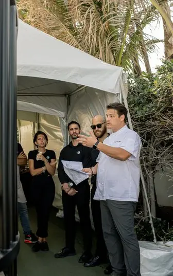 Chef Paul Aceto briefing the Silver Spoon Events team before service