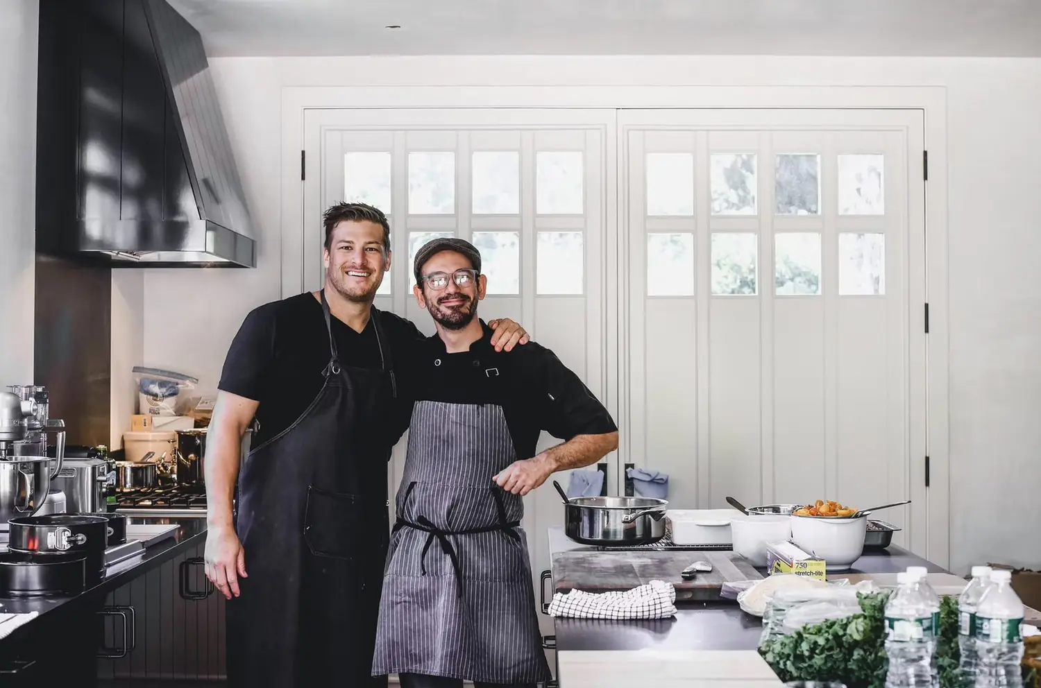 Chef Paul Aceto with a fellow chef in a private kitchen