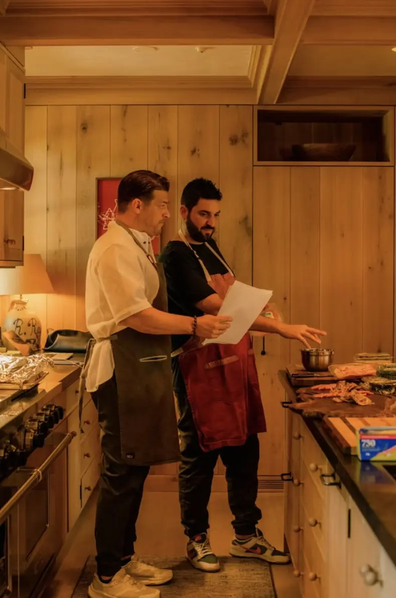 Chef Paul reviewing the menu with a chef in a client's kitchen
